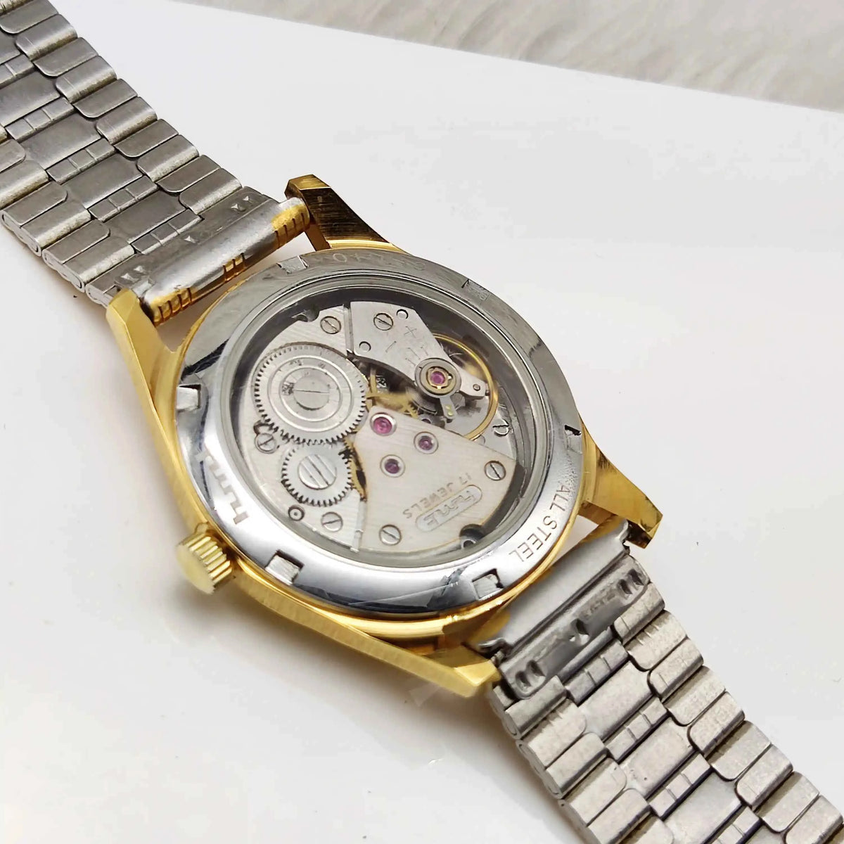 HMT Janata Men's Watch - Handwinding Para Shock 17 Jewels with Golden Dial and Transparent Back