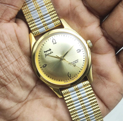 HMT Janata Men's Watch - Handwinding Para Shock 17 Jewels with Golden Dial and Transparent Back