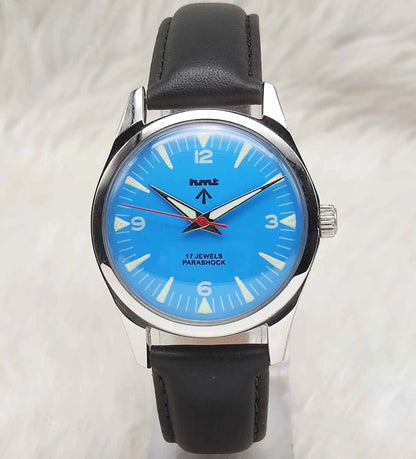 HMT Janata Handwinding Watch with Sky Blue Dial, 17 Jewels, and Transparent Back